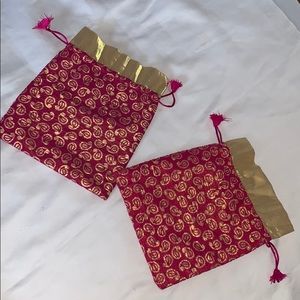 2 small magenta and gold pattern pouches